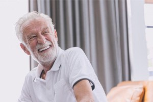 a man in Oakton smiling with his brand-new dentures