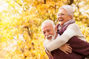 a woman with dentures spending time with her husband