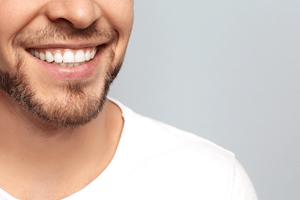 a man smiling after undergoing Invisalign in Oakton