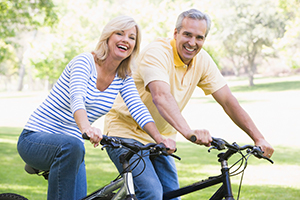 Couple riding bikes together