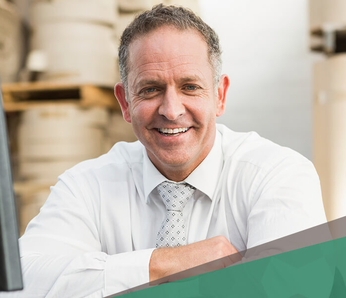 Man in a white shirt with tie smiling