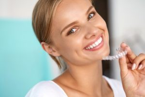 Woman using Invisalign.