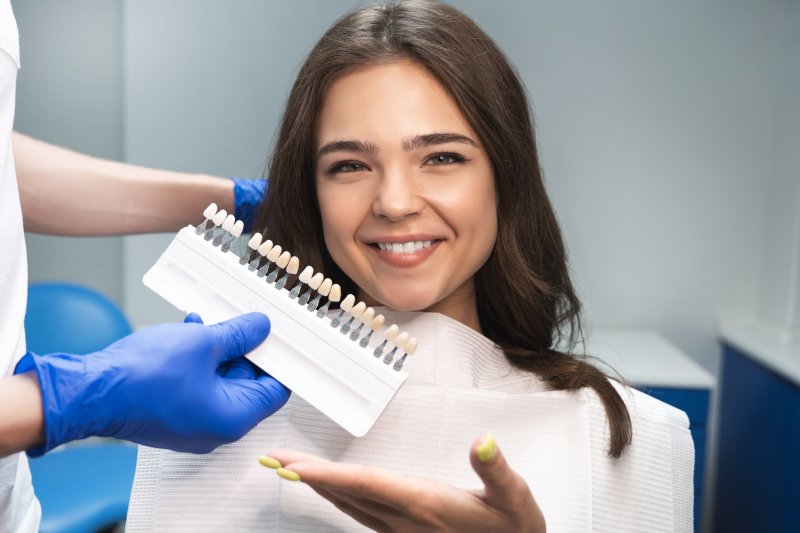 A young woman being assessed for her temporary veneers